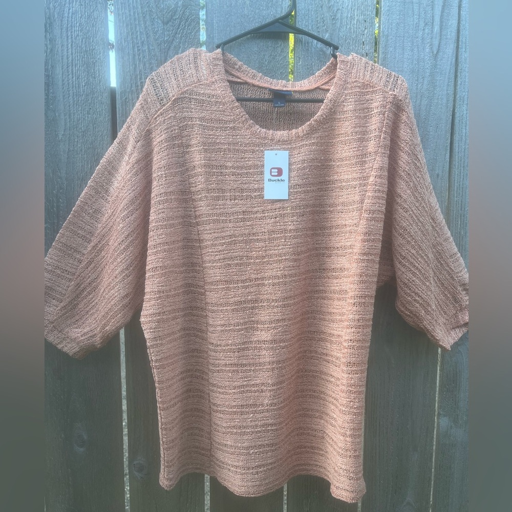 Light orange women’s knitted top